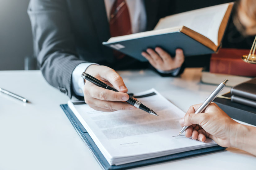 A client and attorney reviewing documents.
