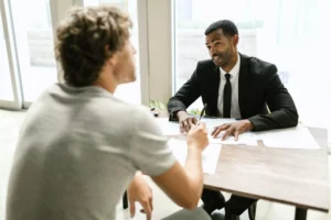 A client speaking with an attorney.