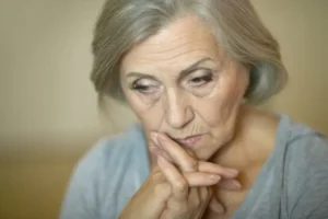 An elderly woman depressed because of abuse in a nursing home-img