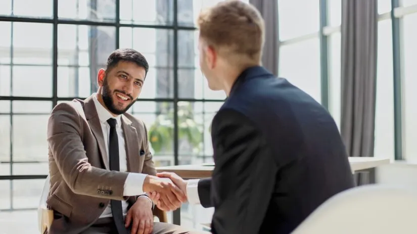 Photo of People Shaking Hands