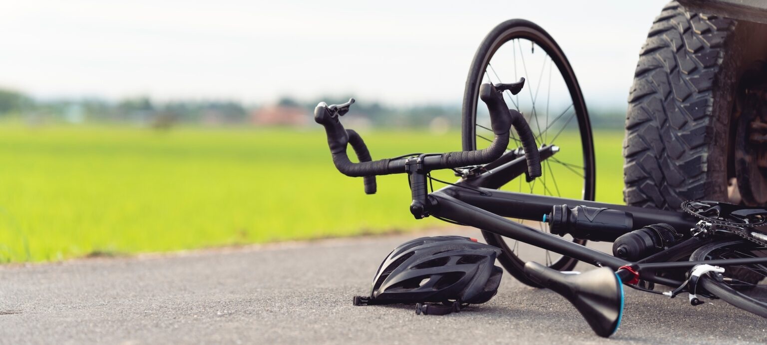 A bicycle lying on the road after an accident