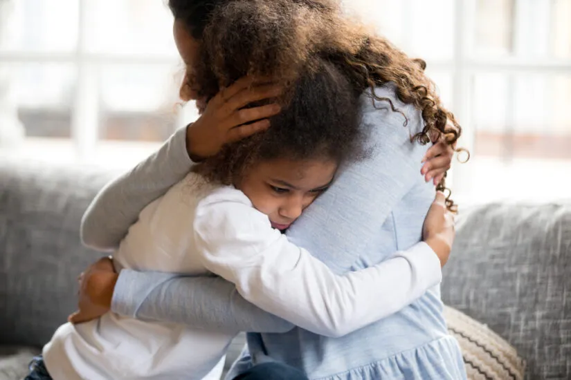 Photo of a Mother Consoling Her Child