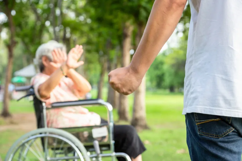 Photo of an elderly woman being abused-image