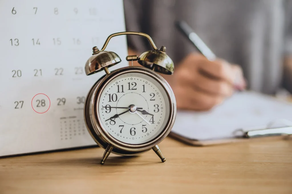 A clock and calendar indicating a deadline.
