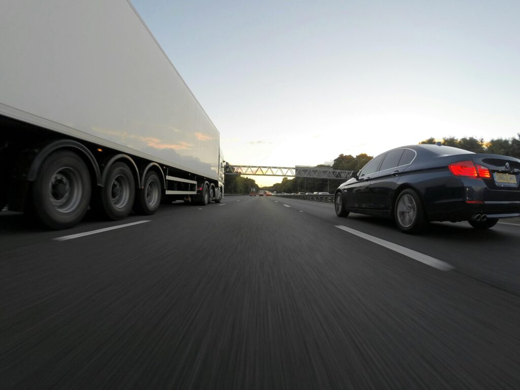 truck and car on the road